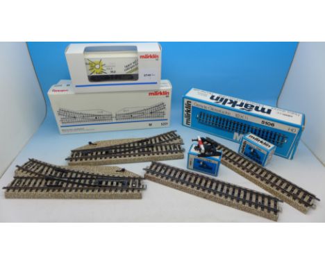 A Marklin HO gauge rail wagon, seven pieces of track, two manual turnouts and two buffers, all boxed