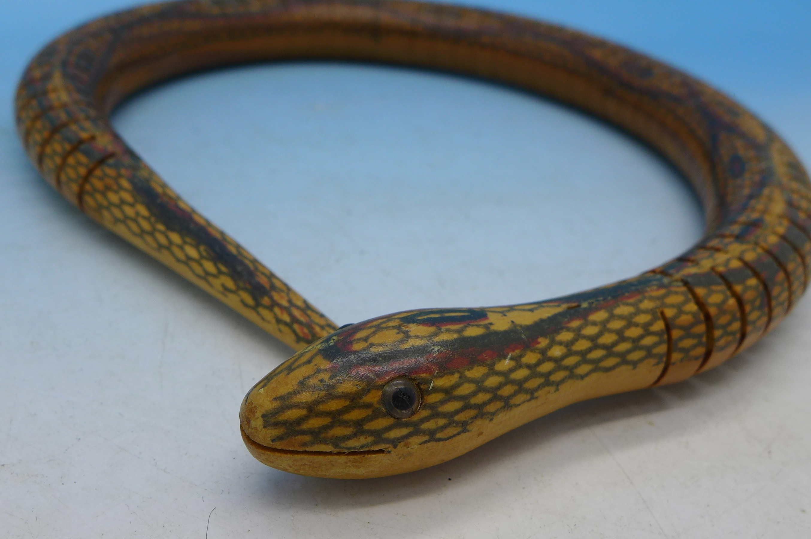 An articulated wooden toy snake