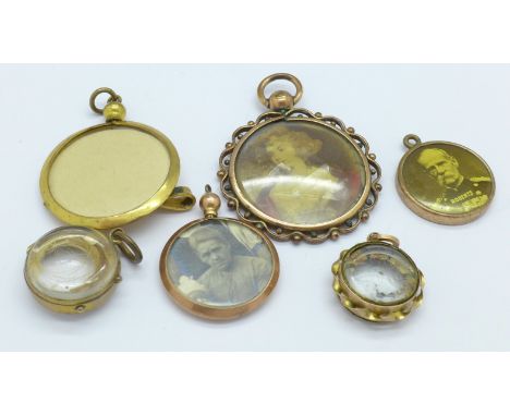 A 9ct gold compass charm, a/f, a 9ct gold photograph locket, three plated pendants and a hair locket