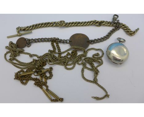 A silver sovereign case lacking button and Albert and guard chains