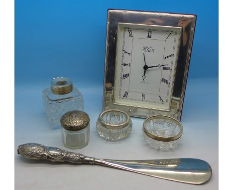 A silver framed clock, a silver handled button hook, etc., a/f