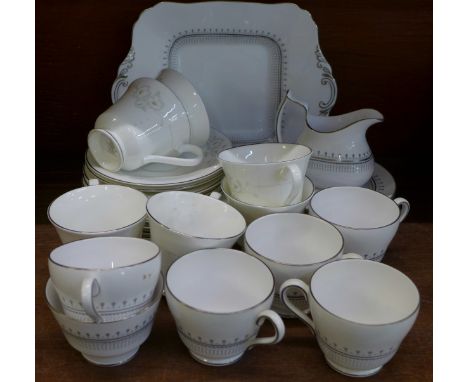 A Royal Doulton Mystique six setting tea set, lacking one saucer and a Spode Fairfax six setting tea set, (Mystique seconds)