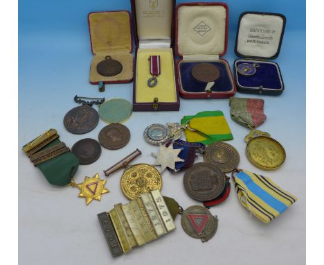 Assorted medals and medallions including a silver and enamel Hampshire Schools F.A. Shield fob and an Army Rifle Association 