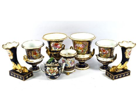 A Bloor Derby three-piece garniture set of campana urns painted with baskets of flowers on a blue and gilt ground, 21/18 cm h