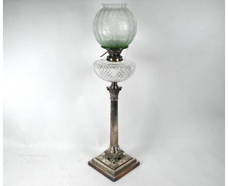 A late Victorian electroplated oil lamp base with reeded classical column supporting cut glass font, with etched green glass 