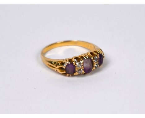 An amethyst and diamond claw set ring, yellow gold set stamped 18ct, size L