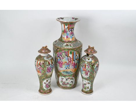 A large 19th century Chinese Canton famille rose vase with tapering body and flared neck, painted in polychrome enamels with 