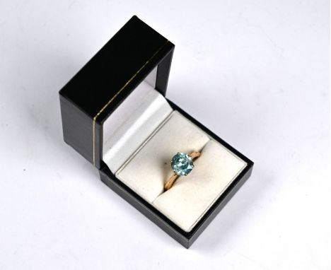 A single stone aquamarine ring in yellow metal high claw setting stamped 9ct, size R