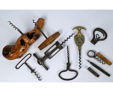 A 19th century steel locking frame corkscrew 'The Challenge', to/w a bow corkscrew with three folding tools, three twisted wi