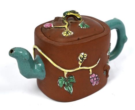 A 20th century Chinese Yixing teapot and cover with naturalistic relief moulded decoration painted in polychrome enamels, imp