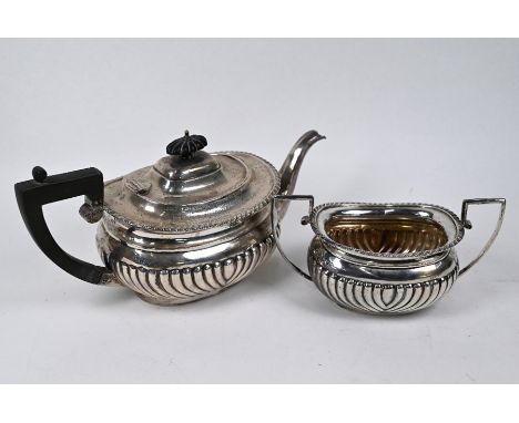 A late Victorian silver half-reeded teapot and matching sugar basin, Nathan &amp; Hayes, Chester 1897, 28oz (880g) gross
