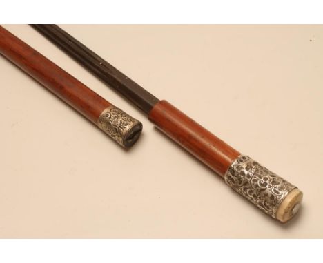 A MALACCA SWORD STICK, c. 1899, with 24 3/4" fullered blade, two silver ferrules embossed with foliage and ivory tip with ins