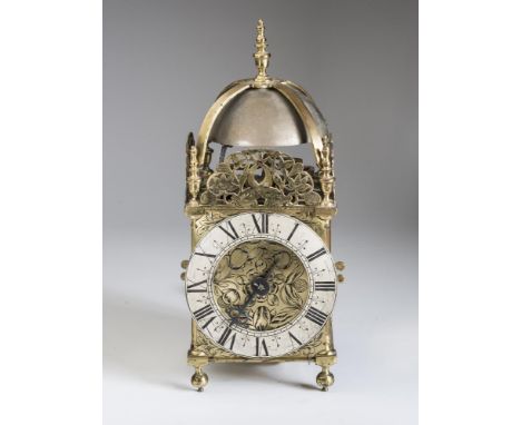 AN ENGLISH BRASS HOOK AND SPIKE LANTERN CLOCK, c.1700, the twin train movement with verge escapement, 6" silvered chapter rin