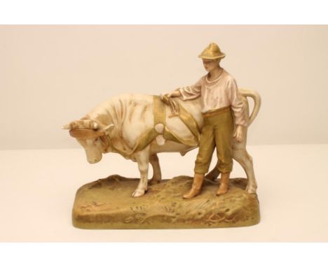 A ROYAL DUX BISQUE PORCELAIN FIGURE, early 20th century, as a young man wearing a hat, pink shirt and green breeches standing