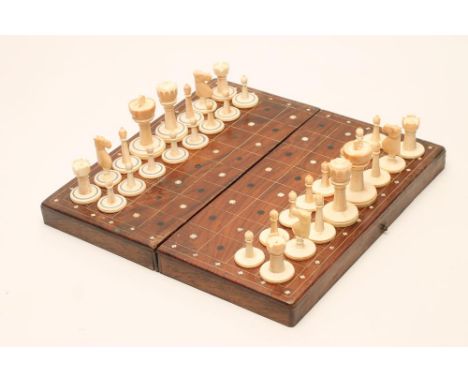 AN ANGLO INDIAN IVORY CHESS SET, late 19th century, all natural, one set with two turned and black stained rings to the bases