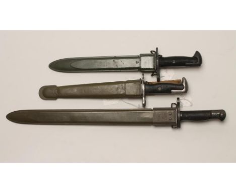 A US M1917 BAYONET, with two piece plastic grip and plastic scabbard, together with two M1 bayonets, one with a painted leath