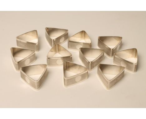 A SET OF TWELVE ART DECO SILVER NAPKIN RINGS, makers Gloster, Sheffield 1927, of triangular form with an engine turned wave b