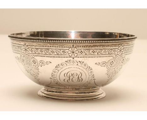 A VICTORIAN SILVER SUGAR BASIN, maker Edward Ker Reid, London 1872, of plain circular form, bright cut with foliate roundels,