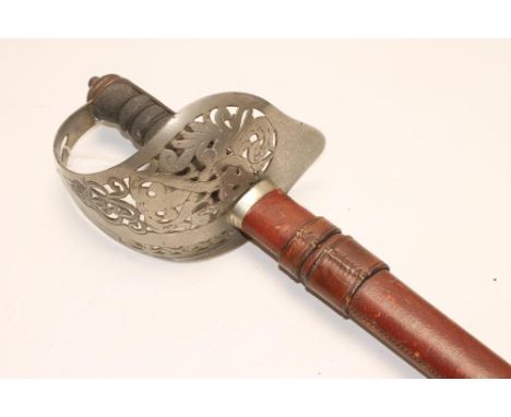 AN 1897 PATTERN INFANTRY OFFICER'S SWORD, the 32 1/2" blade with deep fuller etched with foliage, Royal coat of arms, George 