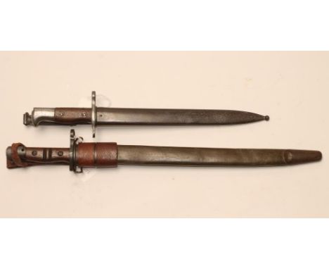 A US REMINGTON 1917 BAYONET, with 16 3/4" blade, leather scabbard and frog, together with a US model 1892 bayonet for the Kra