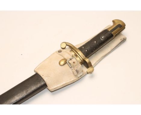 A RARE BRITISH 1860 TYPE VOLUNTEER BAYONET, with 22 7/8" fullered blade, brass cross guard, chequered grip, brass pommel, lea