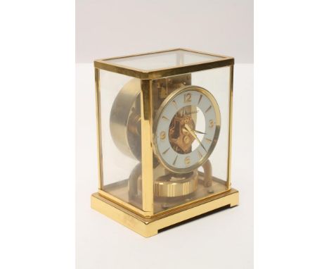 A GILT BRASS CASED JAEGER LECOULTRE ATMOS CLOCK, model No. Classic V, Movement 265928, guarantee certificate dated 1908, the 