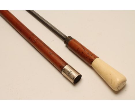 A SCOTTISH MALACCA SWORD STICK, c.1900, with 26 1/4" diamond section tapering blade, silver ferrule bearing marks for Edinbur