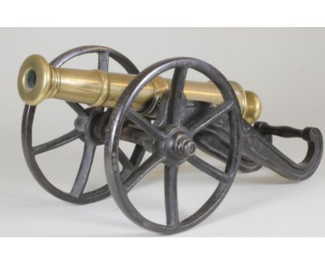 A SIGNAL CANNON, 19th century, the 12 1/4" barrel with ring moulded muzzle, simple trunnions, touch hole, vent, rear knob and