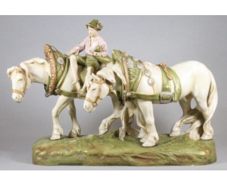 A LARGE ROYAL DUX BISQUE PORCELAIN FIGURE GROUP, c.1920's, modelled as a young boy wearing an open necked pale pink shirt and