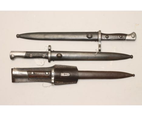 A CHILEAN MODEL 1895 BAYONET, the 10" blade stamped with Chilean coat of arms and Austrian CEWG mark, two piece wood grip and