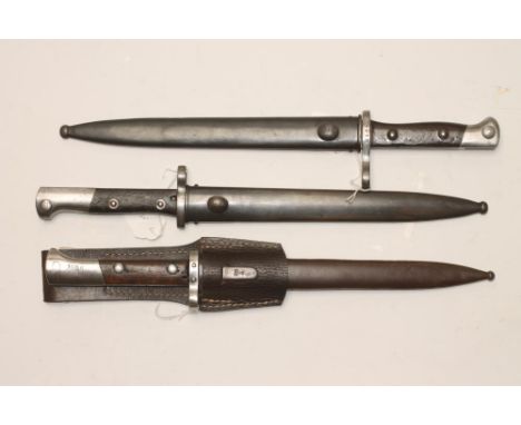 A CHILEAN MODEL 1895 BAYONET, the 10" blade stamped with Chilean coat of arms and Austrian CEWG mark, two piece wood grip and