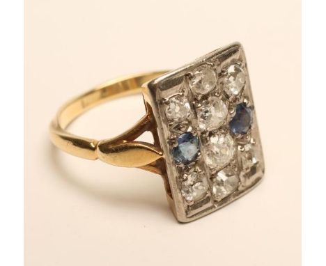 AN ART DECO PLAQUE RING, set with eight old brilliant cut diamonds and two facet cut sapphires, to a plain 18ct gold shank, s