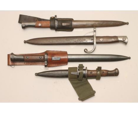 A BELGIAN MODEL 1889 BAYONET, with steel scabbard, together with a Portuguese m948 bayonet with steel scabbard and canvas fro