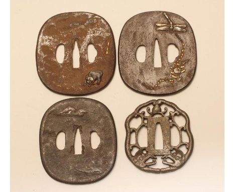 THREE JAPANESE IRON TSUBA, all with inlaid decoration, one depicting a dragon fly, another depicting a beast and the third de