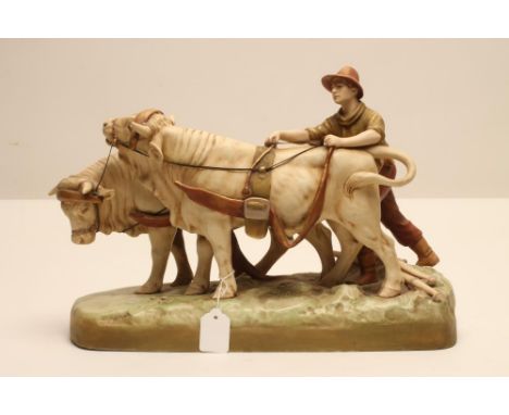 A ROYAL DUX BISQUE PORCELAIN FIGURE, early 20th century, as a young man wearing a brown hat, green top and brown trousers, ha