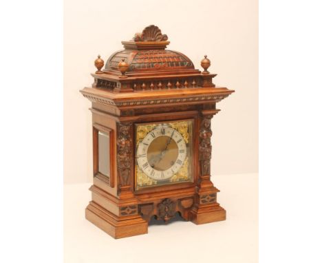 A GERMAN WALNUT CASED MANTEL CLOCK, c.1900, the two train movement stamped RSM, No.584323, and quarter striking on a gong, 6 