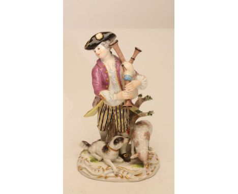 A MEISSEN PORCELAIN FIGURE, late 19th century, modelled as a young man wearing a be-ribboned black tricorn hat, lace trimmed 