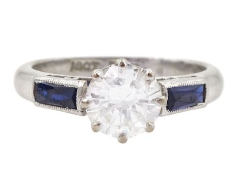 White gold round brilliant cut diamond ring, with milgrain set vari cut sapphire shoulders, stamped 18ct Plat, diamond approx