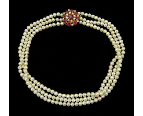 Three strand cultured pearl, with 14ct gold oval cabochon and oval facet ruby and pearl claspCondition Report:Approx 55.5gm, 
