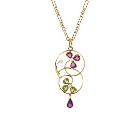 Edwardian gold peridot, garnet and pearl three leaf clover pendant, stamped 15ct, on later 9ct gold Figaro link necklace chai