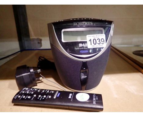 Roberts CRD 40, CD/DAB digital clock radio, with remote control and power supply, working at lotting. All electrical items in