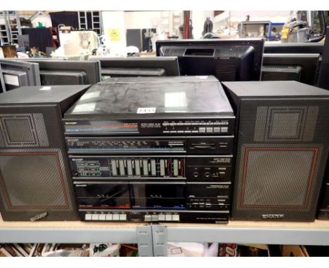 Sharp record/twin tape deck player with speakers and remote. All electrical items in this lot have been PAT tested for safety