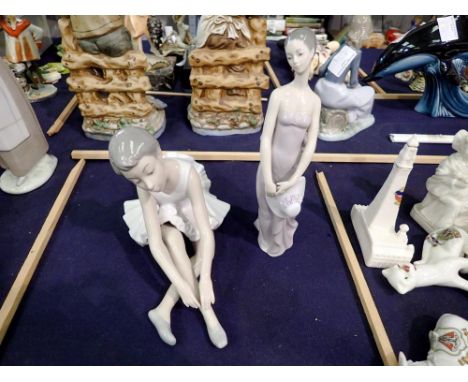 Nao ballerina and a repainted Lladro figurine, largest H: 21 cm. P&amp;P Group 2 (£18+VAT for the first lot and £3+VAT for su