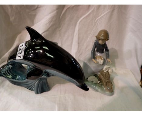 Poole blue dolphin and a Nao figurine of girl with rabbits, largest H: 12 cm. P&amp;P Group 3 (£25+VAT for the first lot and 