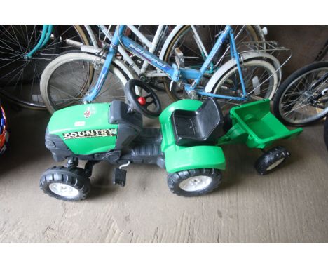 A child's pedal tractor and trailer