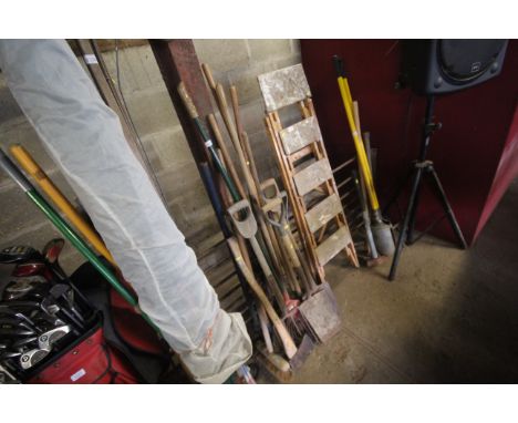 A quantity of gardening tools including digging fork, spade, axe, broom etc
