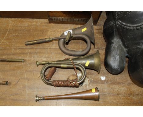 A brass bugle and two horns