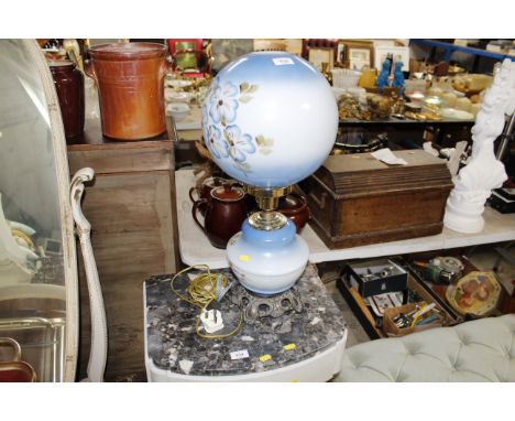 A metal and glass table lamp and shade