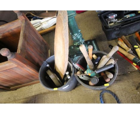 Two buckets and contents of various tools, wooden boards, metal grate, digging fork etc.