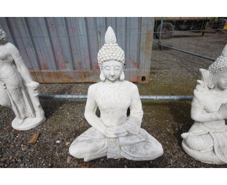 A large cast concrete garden statue in the form of a seated Buddha